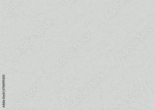 Background of gray paper wallpaper with a uniform texture similar to plaster.