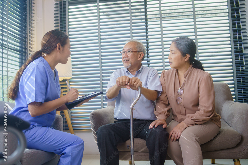 Asian nurse or caregiver visit senior man patient to diagnosis and check up health at home. Physician explain health result to grandfather and grandmother. Healthcare and medical insurance Asian nurse or caregiver visit senior man patient to diagnosis and check up health at home. Physician explain health result to grandfather and grandmother. Healthcare and medical insurance