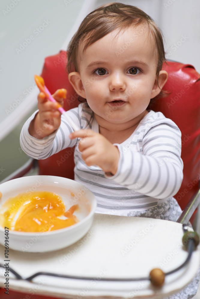 Baby, high chair and food in bowl for meal, nutrition or healthy porridge with spoon at home. Portrait of young cute little child, kid or toddler playing with snack for hunger, vitamins or nutrients Baby, high chair and food in bowl for meal, nutrition or healthy porridge with spoon at home. Portrait of young cute little child, kid or toddler playing with snack for hunger, vitamins or nutrients