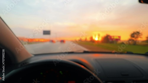 Sunset road trip: Car POV driving experience as the sun sets photo