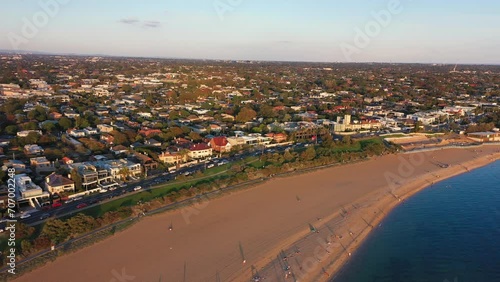 Aerial video flying along the the beach of Brighton in Melbourne, Australia photo