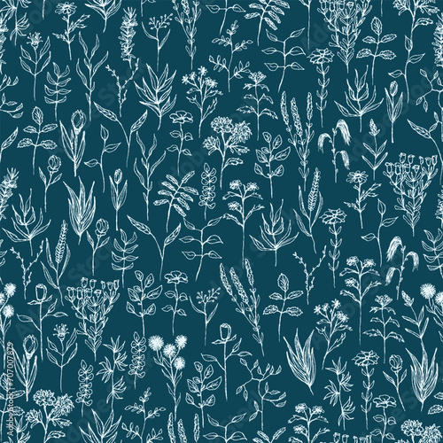 Seamless vector blue floral pattern. Different delicate branches on dark blue background. Lots of wild plants, flowers and herbs.