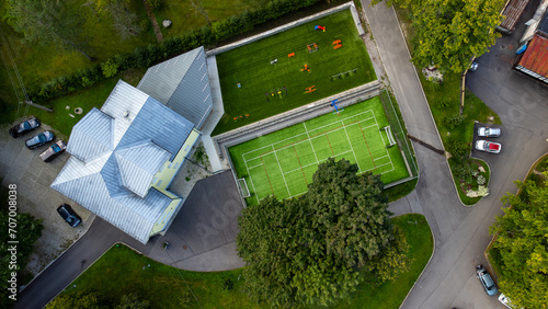 Aerial photo of school with football field. 