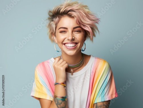 Happy pretty gen z blonde young woman, smiling girl with short blond hair tattoos wearing striped t-shirt denim dress rainbow bracelet showing peace sign standing isolated on white,