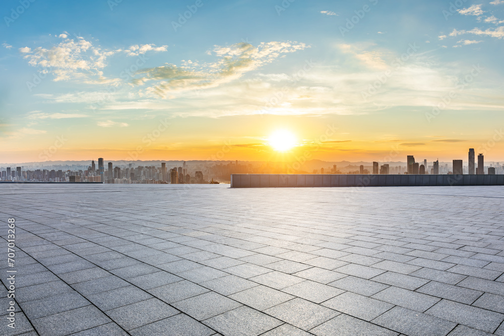Empty square floor and city skyline landscape at sunset. High Angle view.