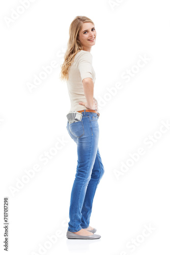 Portrait, woman and money in jeans pocket for financial freedom, gambling and lottery bonus in studio on white background. Happy winner with cashback savings, wealthy investment and finance in pants