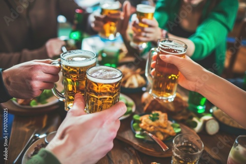 People Celebrating St Patrick's Day in a Irish Beer Pub in a leprechaun costumes. Saint Patrick's Day Concept with Copy Space. Group of friends drinking beer and having fun in a Irish Pub. St. Patrick