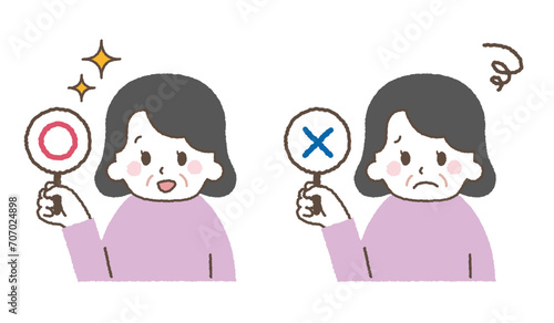 マルバツを持つおばあさんのイラスト。