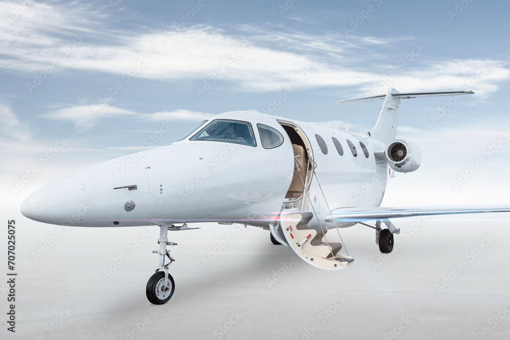 White business jet with an opened gangway door isolated on bright background with sky - obrazy, fototapety, plakaty 