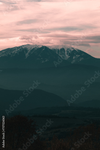 Vertical panorama of Pirin Mountain in Bulgaria from far away.