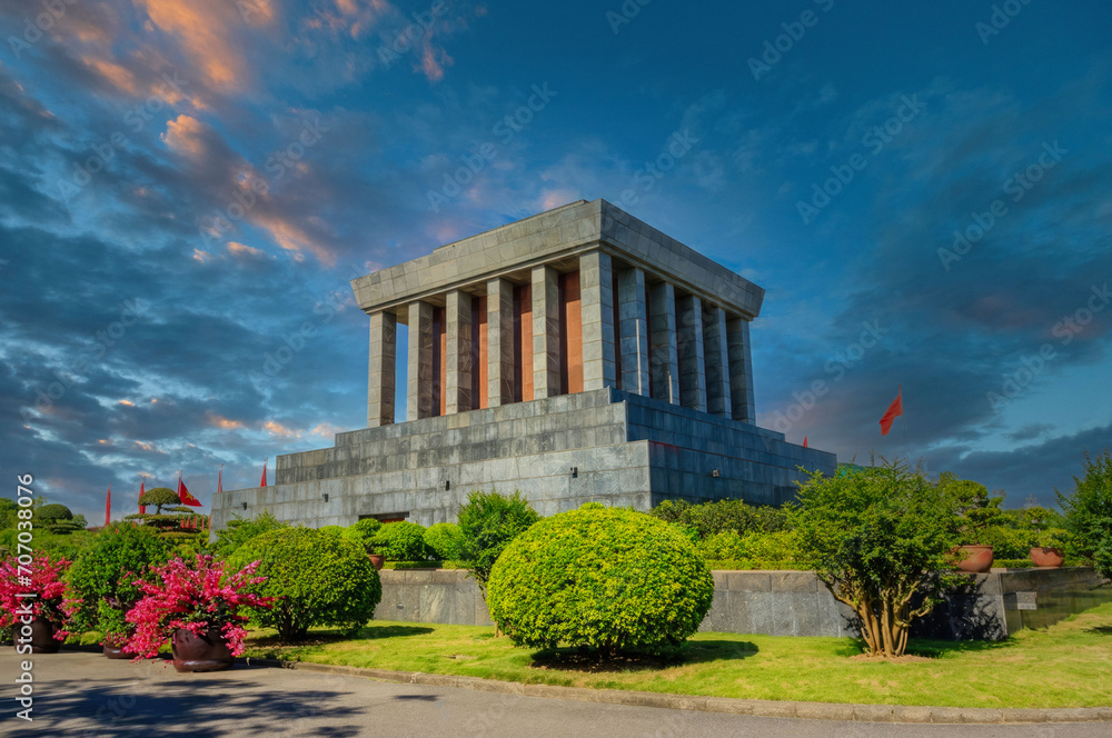 Imposing Mausoleum with Pillars, Red Flags, and Manicured Gardens at Dusk, Historical Monument Site