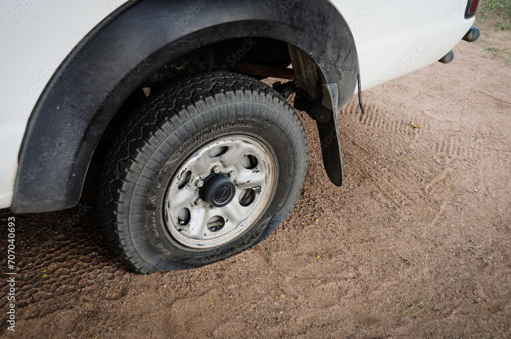 stranded car, flat tire in namibia, stuck pickup truck in the desert