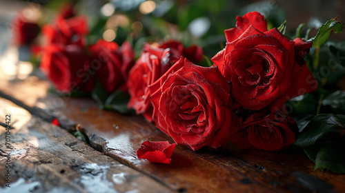 beautiful red roses with drops of water on a wooden table background love romantic holidays valentine  mother s day