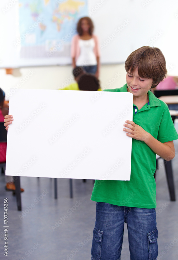 Boy, child and poster in classroom for education or learning with teacher at school. Young male person, little teen or kid smile with banner for advertising, message or marketing on mockup space Boy, child and poster in classroom for education or learning with teacher at school. Young male person, little teen or kid smile with banner for advertising, message or marketing on mockup space