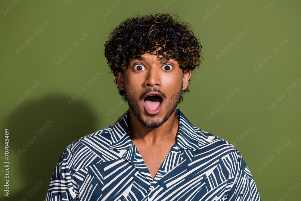 Portrait photo of young hispanic funny man in summer shirt amazed open mouth cant believe your words isolated on khaki color background Portrait photo of young hispanic funny man in summer shirt amazed open mouth cant believe your words isolated on khaki color background