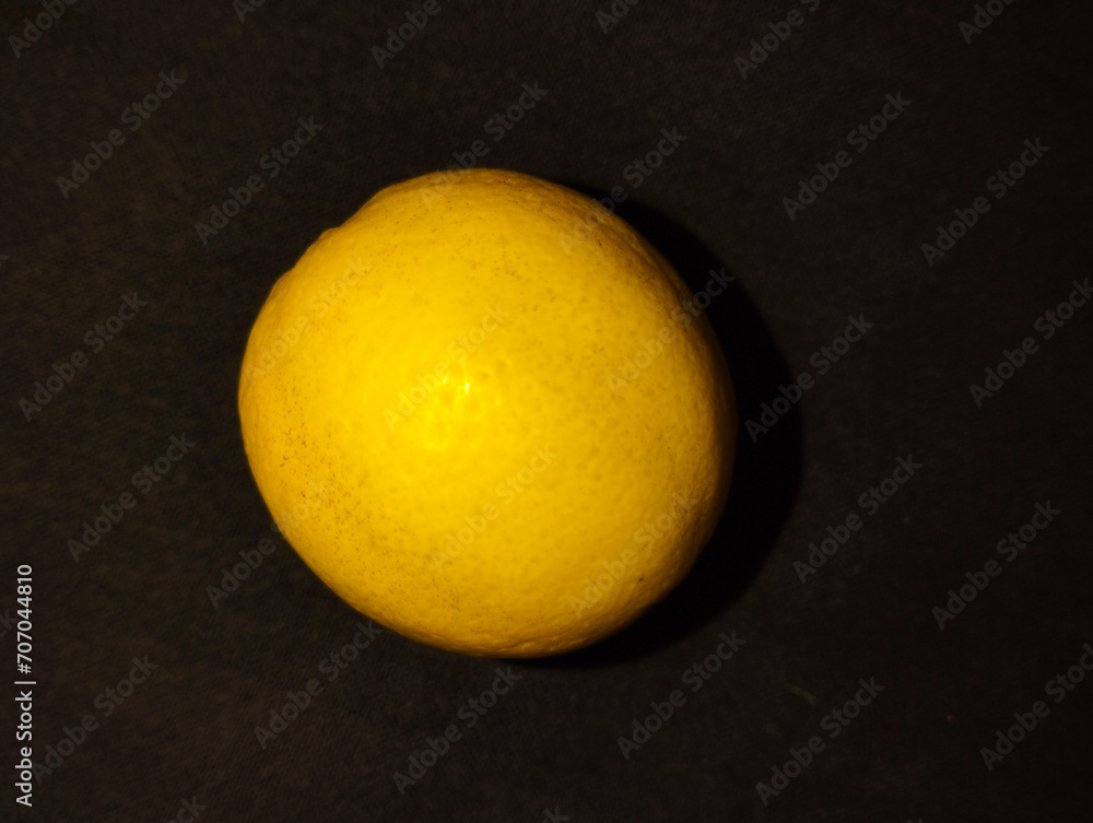 Fresh Isolated lemon on black background Fresh Isolated lemon on black background