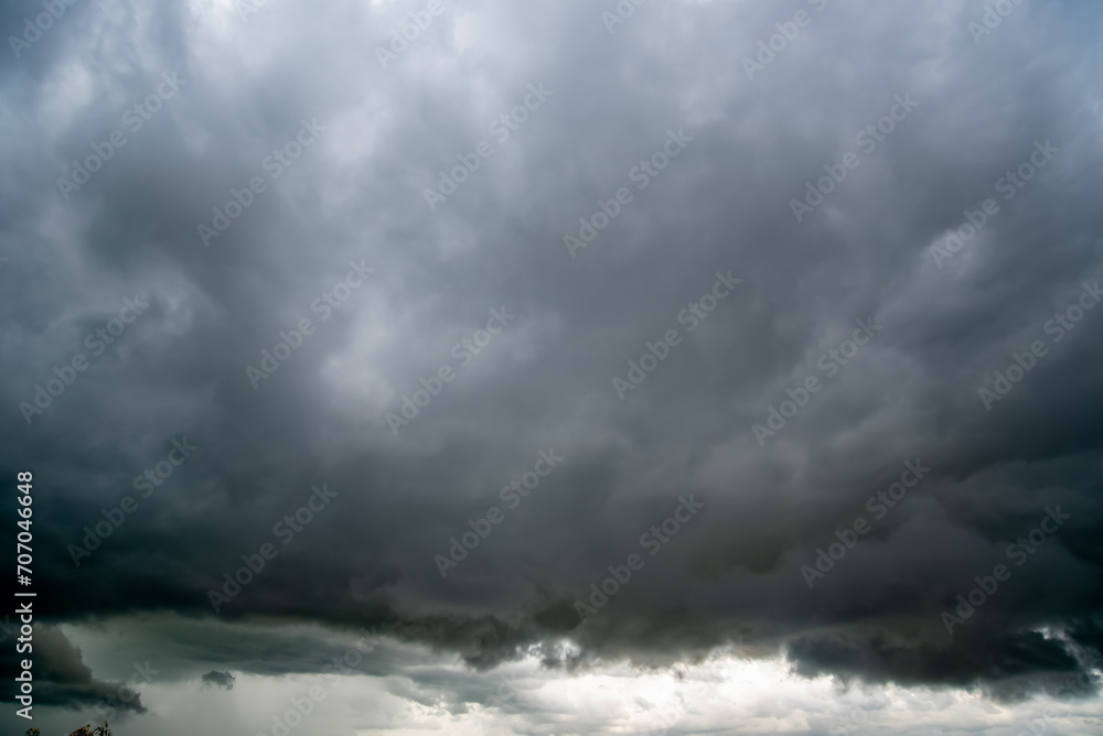 Dark sky with stormy clouds. Dramatic sky rain,Dark clouds before a thunder-storm. Dark sky with stormy clouds. Dramatic sky rain,Dark clouds before a thunder-storm.
