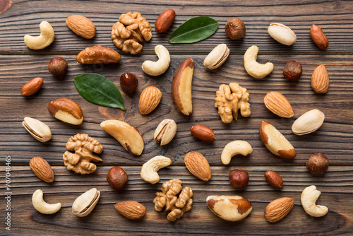Composition of nuts , flat lay - mix hazelnuts, cashews, almonds on table background. healthy eating concepts and food background