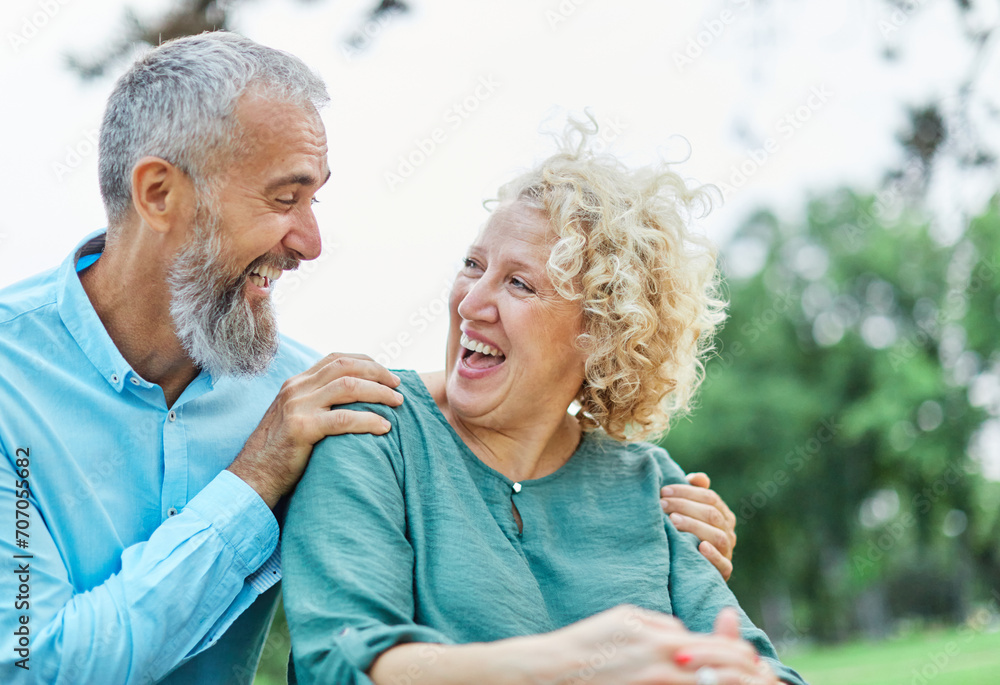 woman man couple happy together hug bonding mature mid middle age aged park outdoor talking leisure fun smiling love old nature wife happiness lifestyle people adult caucasian husband togetherness - obrazy, fototapety, plakaty 