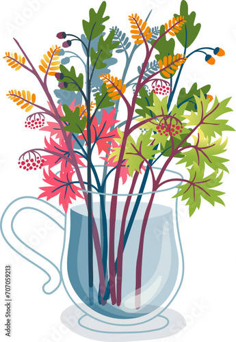 Colorful bouquet of autumn leaves and berries in a transparent cup. Fall seas...