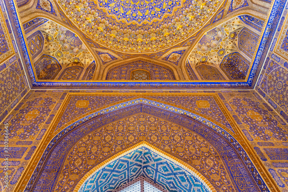 Interior of Tilya Kori Madrasah in Registan. Masterpiece of XVII century. Golden and blue ornaments. April 24, 2023. Samarkand, Uzbekistan