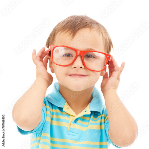 Child, boy and frames or glasses in studio, eyes and vision support by white background. Male person, kid and ophthalmology for eyecare, red spectacles and stylish fashion by backdrop for wellness