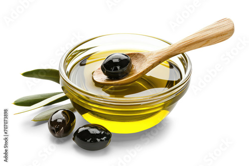 Extra virgin olive oil in a glass container with olives and wooden spoon, isolated from white background photo