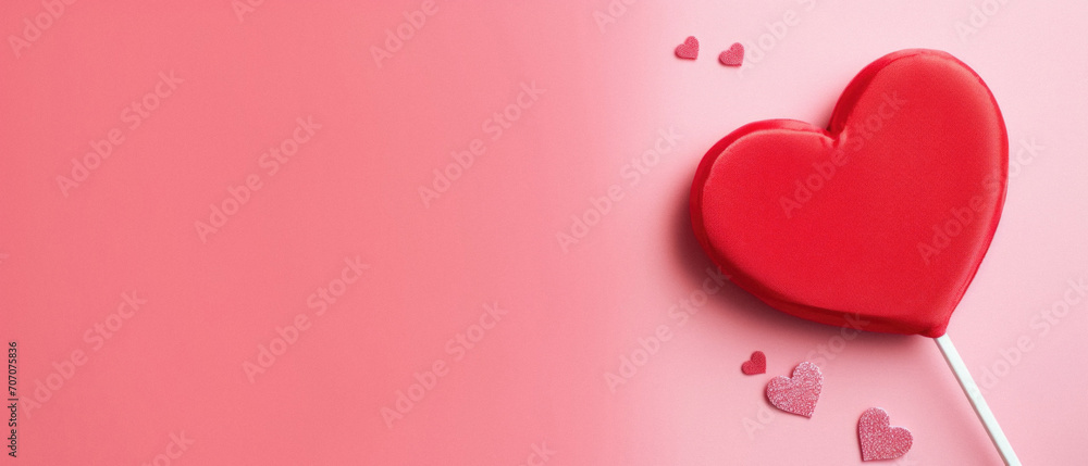 Valentine's day background with red heart on pink background.