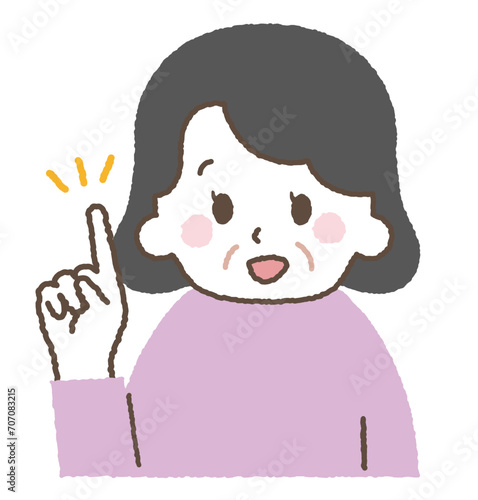 指をさして説明するおばあさん。