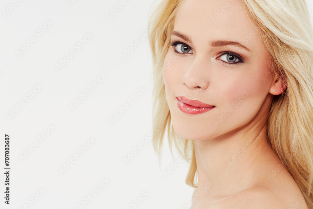 Fototapeta premium Cosmetic, beauty and portrait of woman with makeup in white background, studio and space. Blonde, model and serious face with facial skincare, dermatology or hair care from salon or spa mock up
