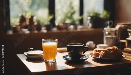 Morning breakfast with coffee, juice, and croissant on a table photo