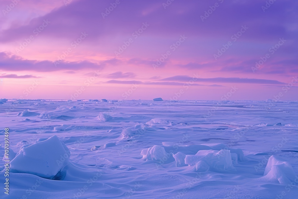 A frozen expanse of ice meets a stunning sky in shades of purple and pink, as clouds drift above the arctic landscape of melting glaciers and sea ice in the frigid yet breathtaking beauty of winter's A frozen expanse of ice meets a stunning sky in shades of purple and pink, as clouds drift above the arctic landscape of melting glaciers and sea ice in the frigid yet breathtaking beauty of winter's