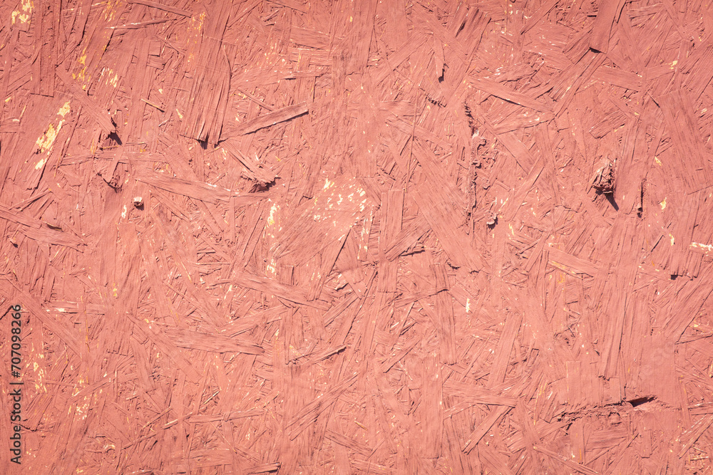 Chipboard board painted with red paint as an abstract background Chipboard board painted with red paint as an abstract background