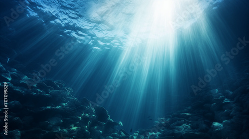 Dark blue ocean surface seen from underwater, Abstract image of Tropical underwater dark blue deep ocean wide nature background with rays of sunlight, Ai generated image