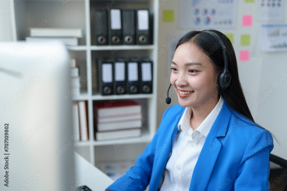 Asian call center girl working to provide customer service through online communication channels, business operator providing customer service online Communicate business information to customers. Asian call center girl working to provide customer service through online communication channels, business operator providing customer service online Communicate business information to customers.