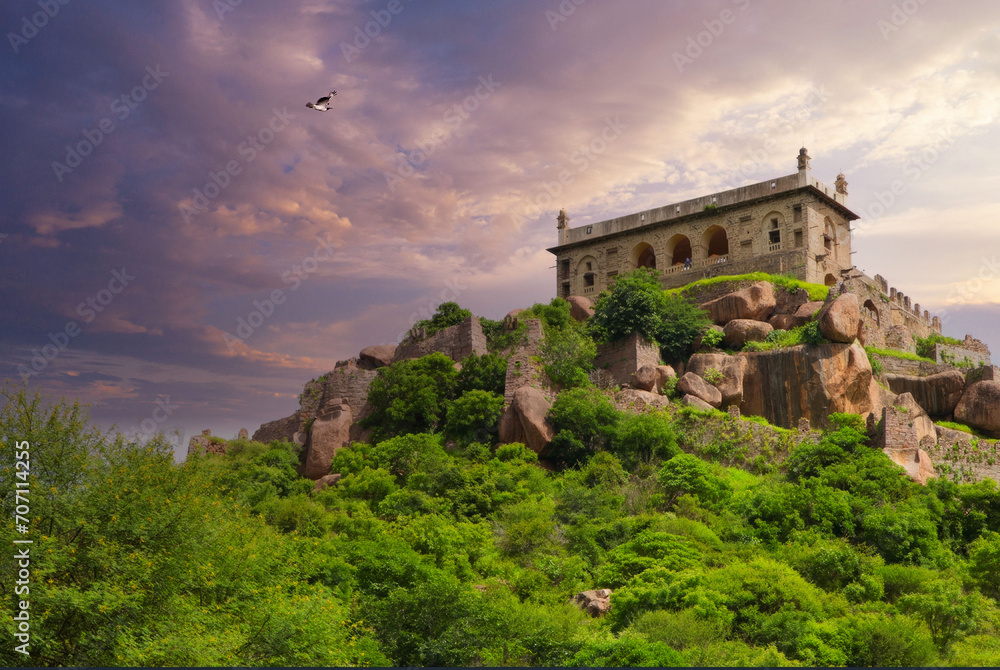 Majestic Historical Palace on Rugged Hill Amidst Lush Greenery, Bird in Flight, Purple Sky