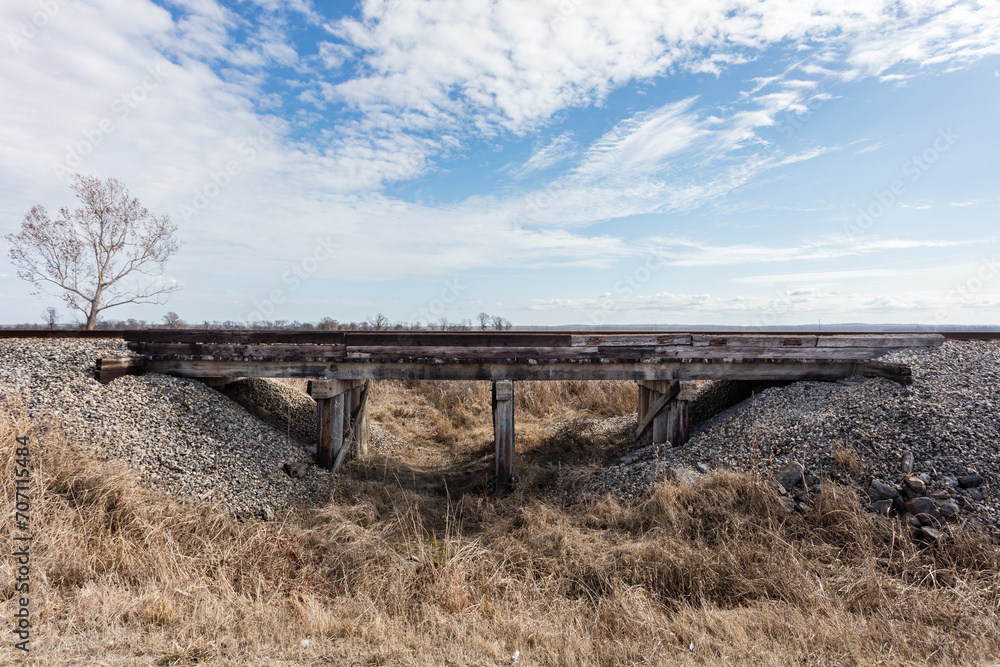 Railroad crossing with old wooden overpass in deep rural Mississippi Railroad crossing with old wooden overpass in deep rural Mississippi