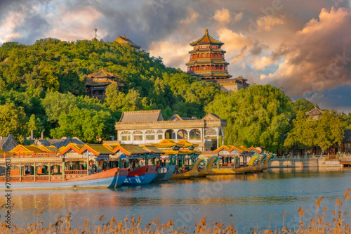 Serene Sunrise at Summer Palace, Beijing: Reflections on Kunming Lake with Dragon Boats and Buddhist Tower. photo