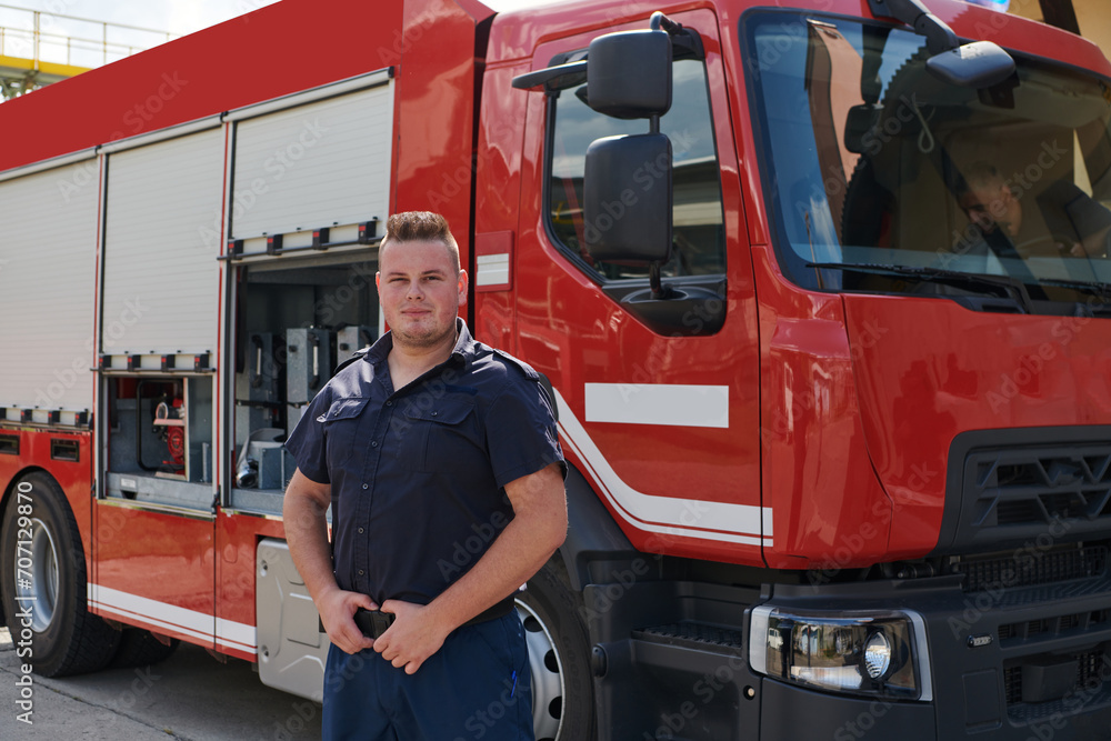 A confident firefighter strikes a pose in front of a modern firetruck, exuding pride, strength, and preparedness for emergency response A confident firefighter strikes a pose in front of a modern firetruck, exuding pride, strength, and preparedness for emergency response