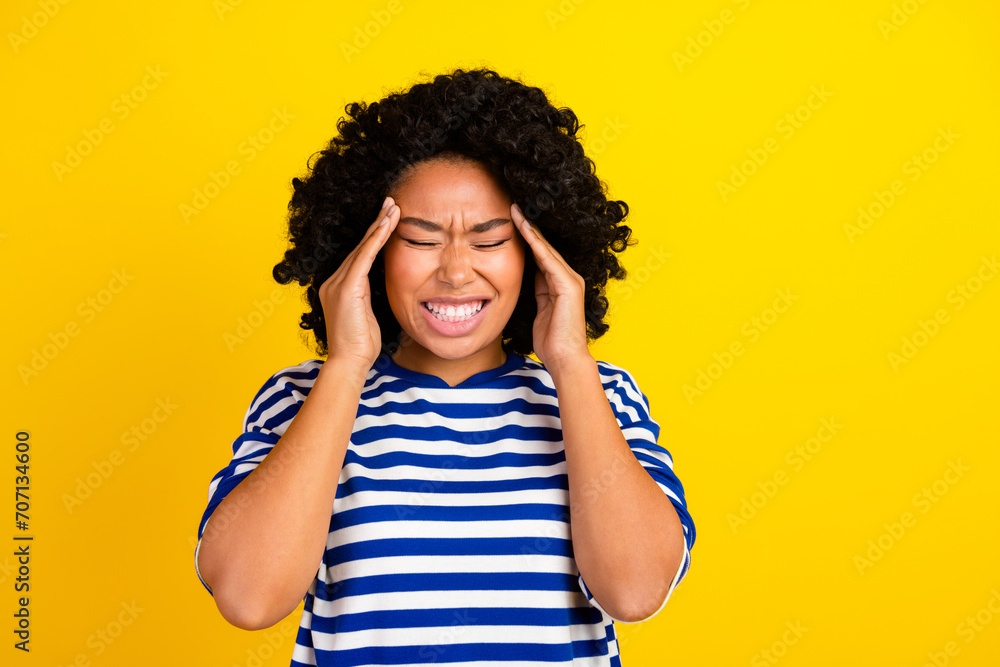 Photo of irritated annoyed girl wear trendy clothes suffering pain headache isolated on yellow color background Photo of irritated annoyed girl wear trendy clothes suffering pain headache isolated on yellow color background