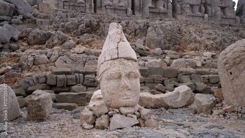 Antique ruined statues on Nemrut mountain in Turkey 4K Ancient stone heads at the top of 2150 meters high Mount Nemrut. photo