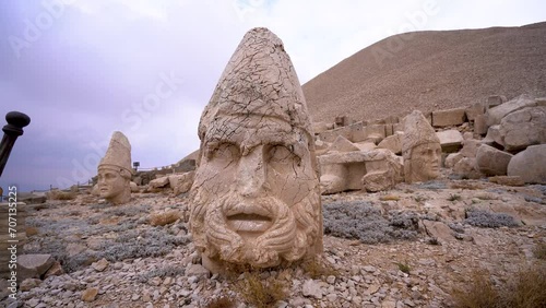 Herakles Statue behind Stone Thrones at Mount Nemrut in Adiyaman, Turkey 4K Mount Nemrut in southeastern Turkey and royal tombs is from the 1st century. photo