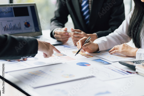 Business people meeting together brainstorming business strategy analysis and investment planning. Financial consultant discuss analysis financial chart and market growth graph for business planning.