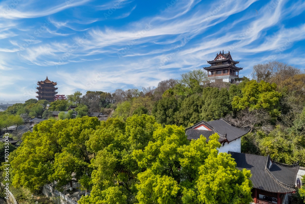 Traditional Pagodas on Lush Hilltop under Dynamic Sky, East Asian Historical Site, China
