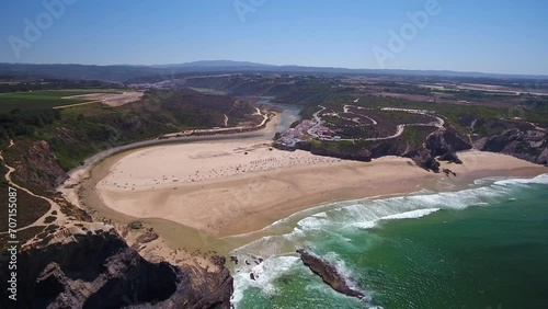 Aerial video filming by drone of the sea bay and beach near the village of Odeceixe Alentejo Portugal. Birds eye view