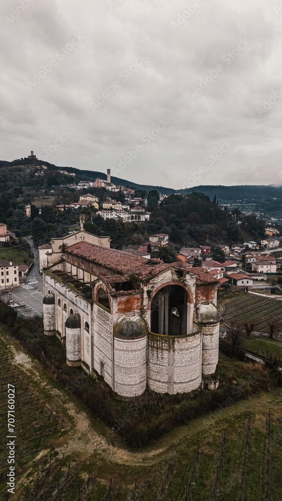 Fototapeta premium Brendola Incompiuta Cathedral, Vicenza Italy. Aerial view of the church on a cloudy afternoon.