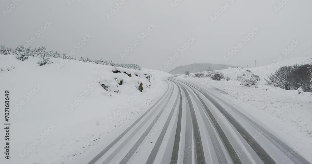 Driving POV of snow covered closed mountain road Driving POV of snow covered closed mountain road