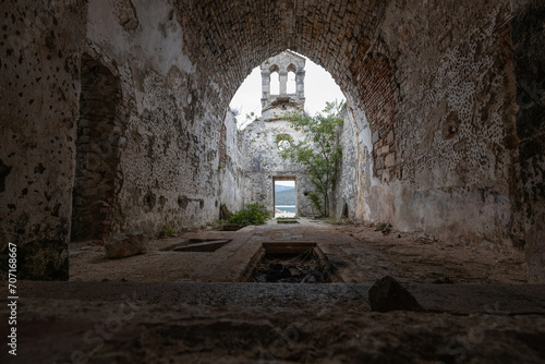 Profaned Empty Tombs Indoors Ruins of ancient Monastery of Saint Marry of the Angels - Osor , Cres Island Croatia photo