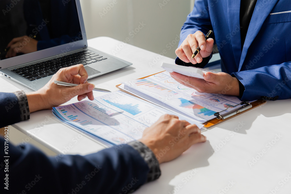 Close up of Asian male company executives working together reviewing business in the office Close up of Asian male company executives working together reviewing business in the office