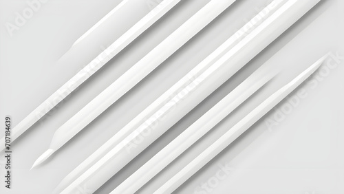 a close up of a group of white knitting needles on a white surface